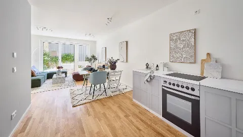 Küche und Wohnzimmer des Musterhauses in UP TOWN Houses.